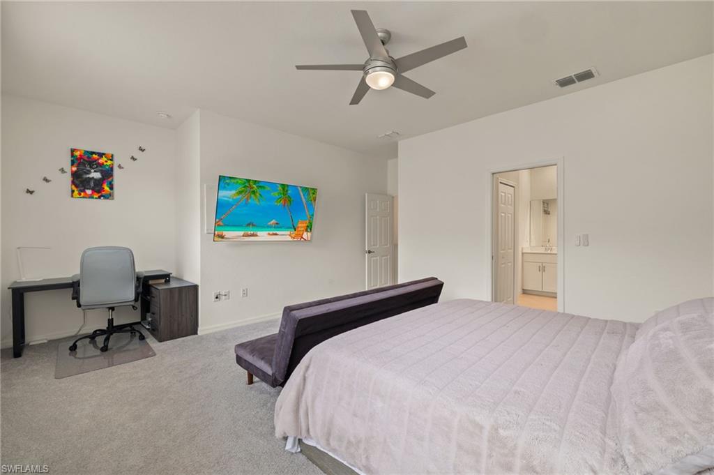2934 Citrus Street Naples, FL 34120 - Photo 12 of 29 a bedroom with a workspace