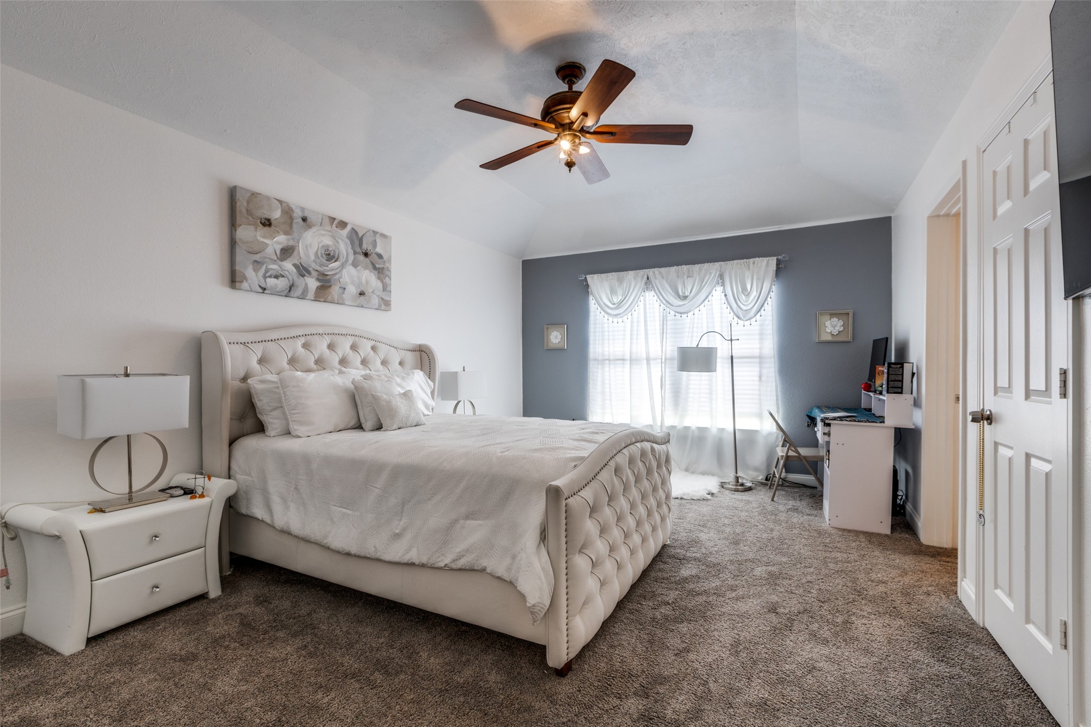 8 Cypress Point Court Manvel, TX 77578 - Photo 14 of 18 a spacious bedroom with a bed and a window