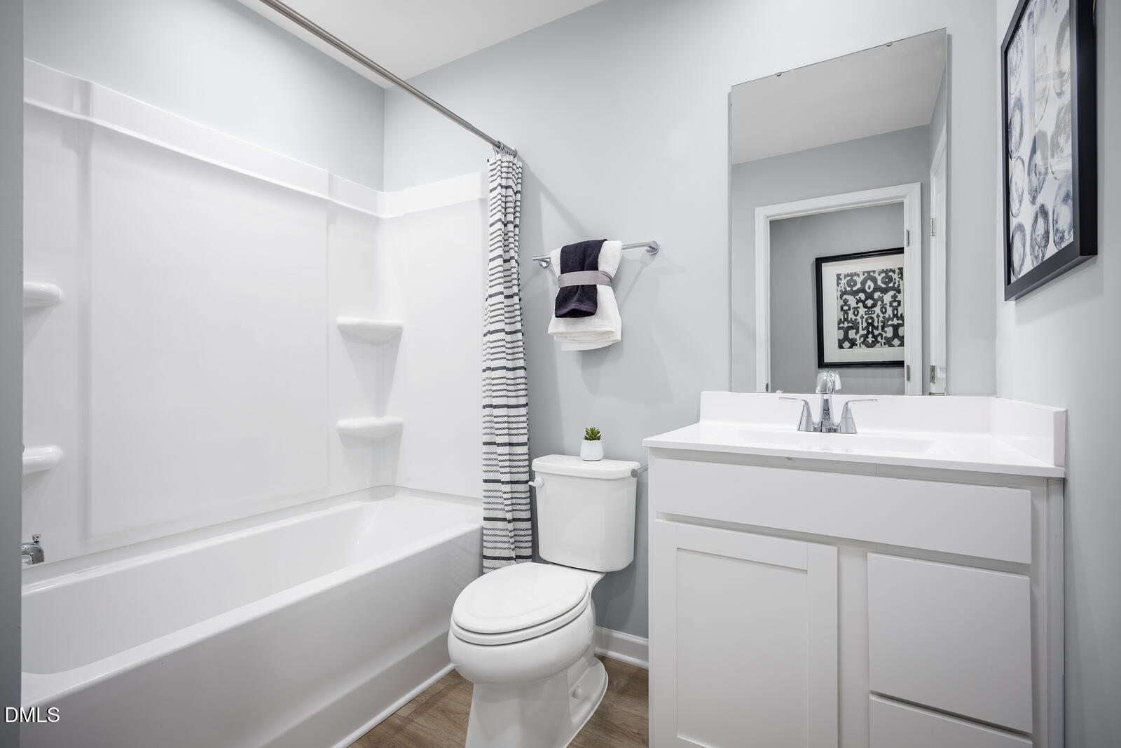 211 Brook Bawn Road Wendell, NC 27591 - Photo 16 of 25 a bathroom with a granite countertop sink toilet and shower