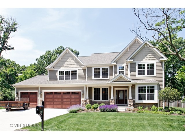 287 Hickory Road Lake Zurich, IL 60047 - Photo 1 of 25 a front view of a house with garden