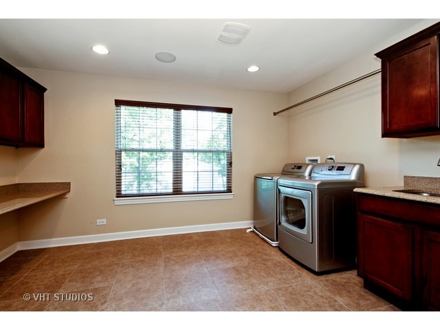 287 Hickory Road Lake Zurich, IL 60047 - Photo 11 of 25 a utility room with sink dryer and washer