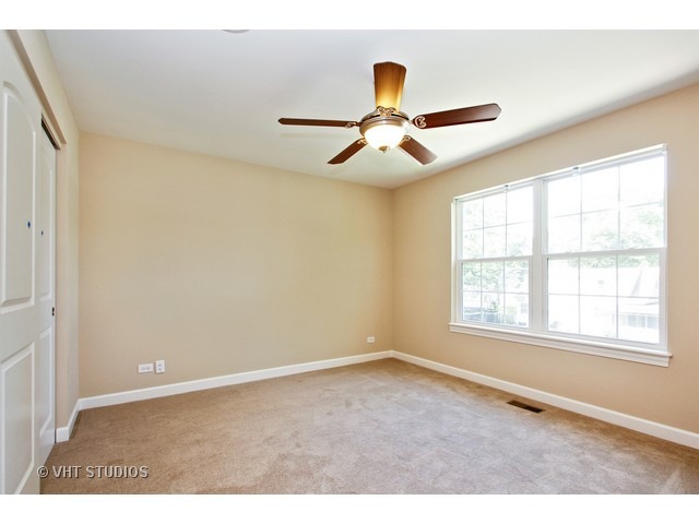 287 Hickory Road Lake Zurich, IL 60047 - Photo 18 of 25 a view of an empty room with a window