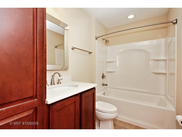 287 Hickory Road Lake Zurich, IL 60047 - Photo 19 of 25 a bathroom with a sink a toilet and shower