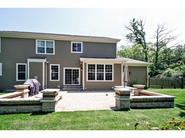 287 Hickory Road Lake Zurich, IL 60047 - Photo 23 of 25 a front view of a house with a yard and sitting area