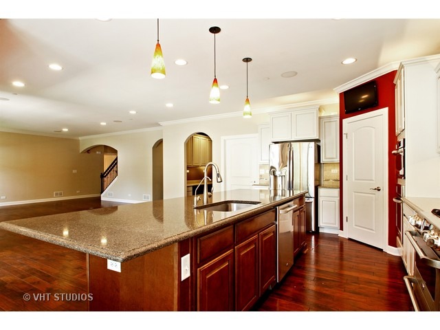 287 Hickory Road Lake Zurich, IL 60047 - Photo 3 of 25 a kitchen with stainless steel appliances a sink and a refrigerator