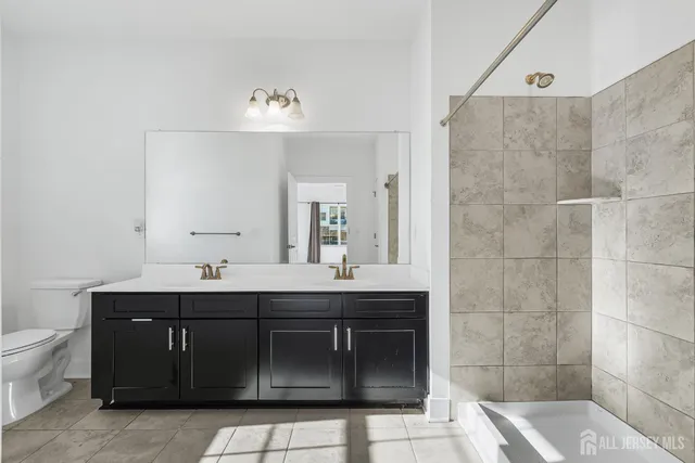 a bathroom with a sink double vanity and a mirror