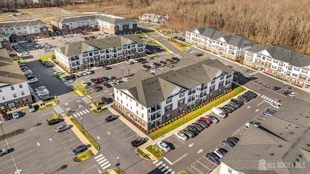 a view of multiple houses with a street