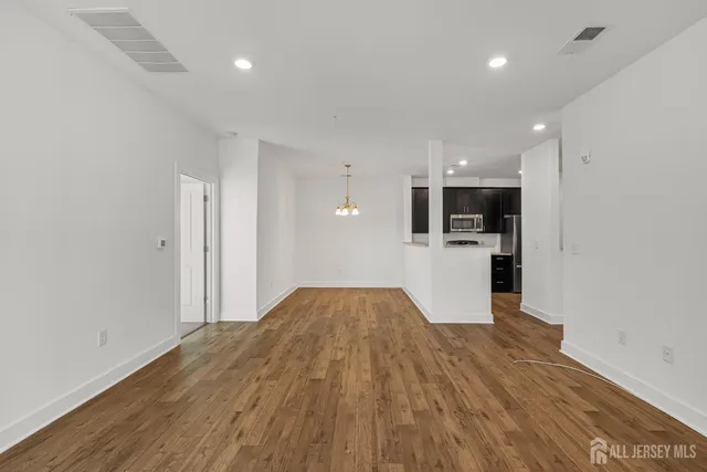 a view of kitchen with wooden floor