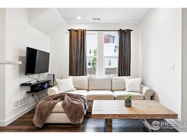 a bathroom with a sink a toilet a mirror and shower
