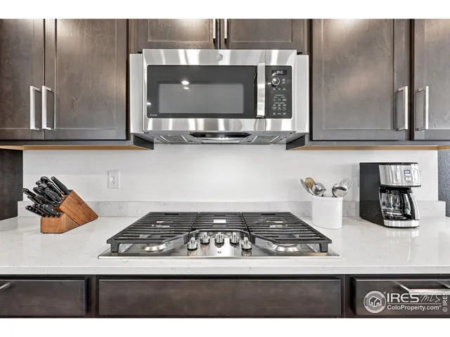 a kitchen with a stove and cabinets