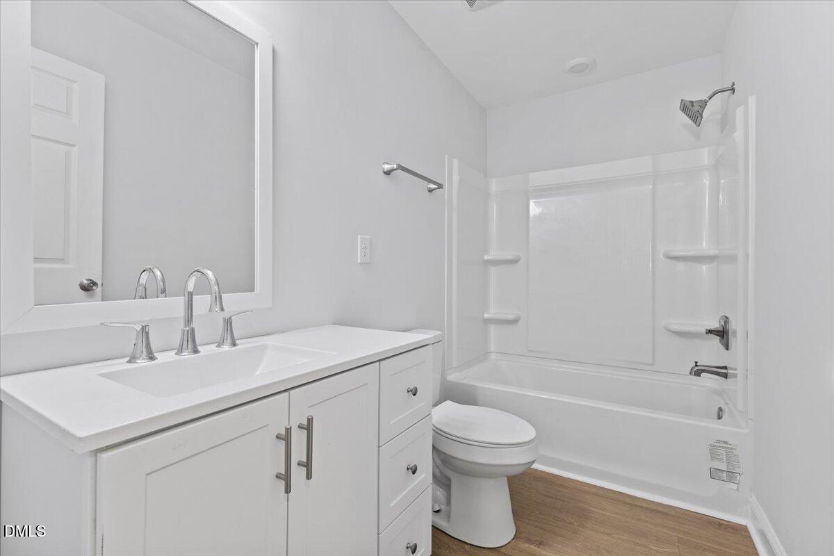 315 Hamilton Street Henderson, NC 27536 - Photo 11 of 13 a bathroom with a sink toilet and shower