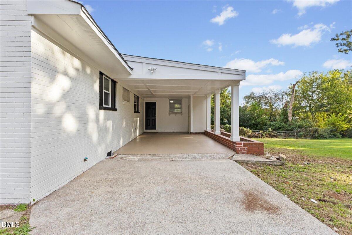 315 Hamilton Street Henderson, NC 27536 - Photo 12 of 13 a view of a house with backyard and garden