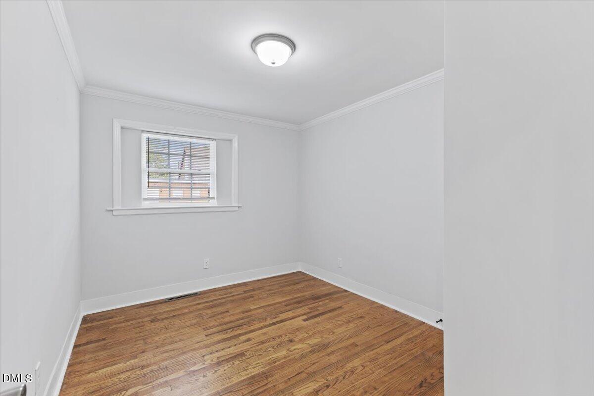 315 Hamilton Street Henderson, NC 27536 - Photo 6 of 13 an empty room with a workspace