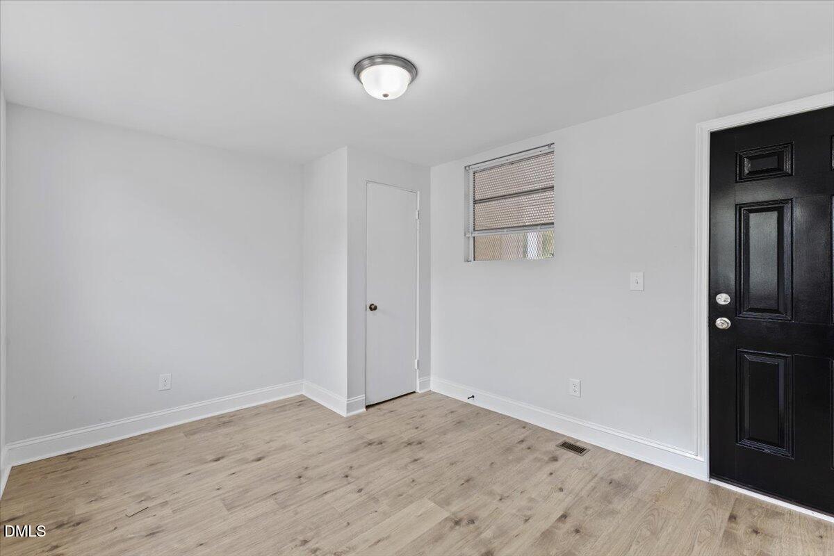 315 Hamilton Street Henderson, NC 27536 - Photo 9 of 13 wooden floor in an empty room