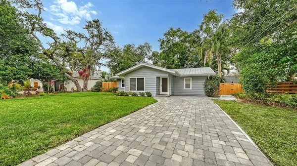 a front view of house with yard and green space