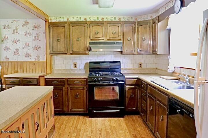 365 Water Street Lee, MA 01238 - Photo 11 of 35 a kitchen with stainless steel appliances granite countertop a stove a sink and a microwave