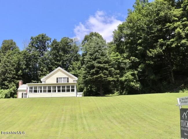 365 Water Street Lee, MA 01238 - Photo 3 of 35 a front view of a house with a yard