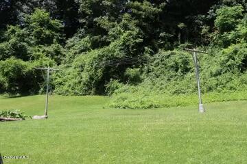 365 Water Street Lee, MA 01238 - Photo 6 of 35 a backyard of a house with lots of green space