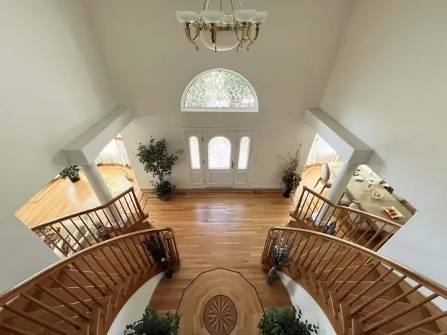 a living room with furniture potted plant and flowers