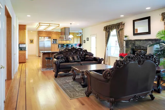 a dining room with furniture and wooden floor