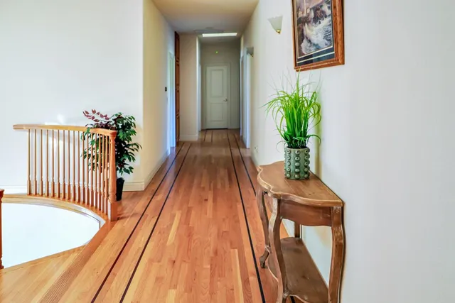a bedroom with a bed a flat screen tv and a couch