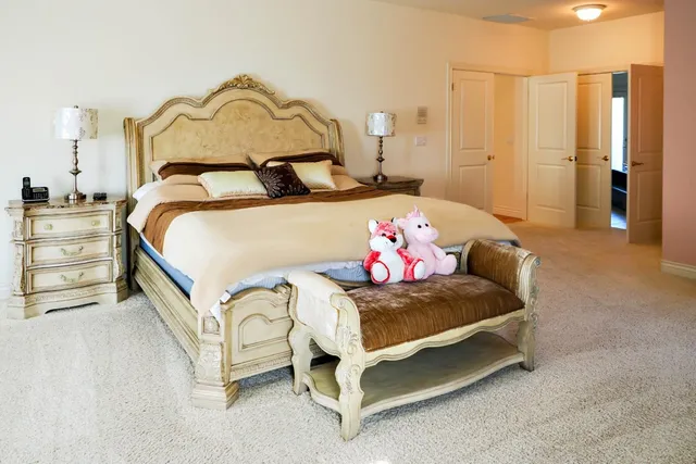 a bedroom with a bed next to a window with the outer view