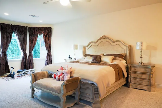 a bedroom with a bed and a window