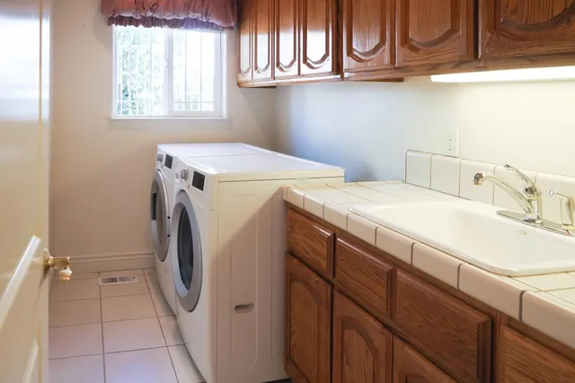 a front view of a house with a yard table and chairs