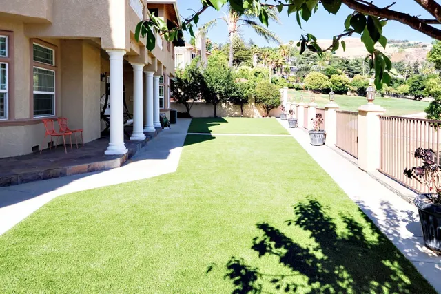 a view of a chairs and table in the balcony