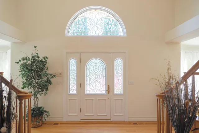 a view of a livingroom with furniture window and hardwood floor