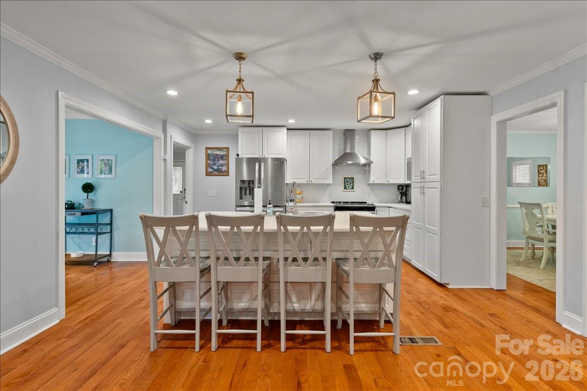209 Fairway Road Cheraw, SC 29520 - Photo 8 of 48 a view of a dining room with furniture wooden floor and chandelier