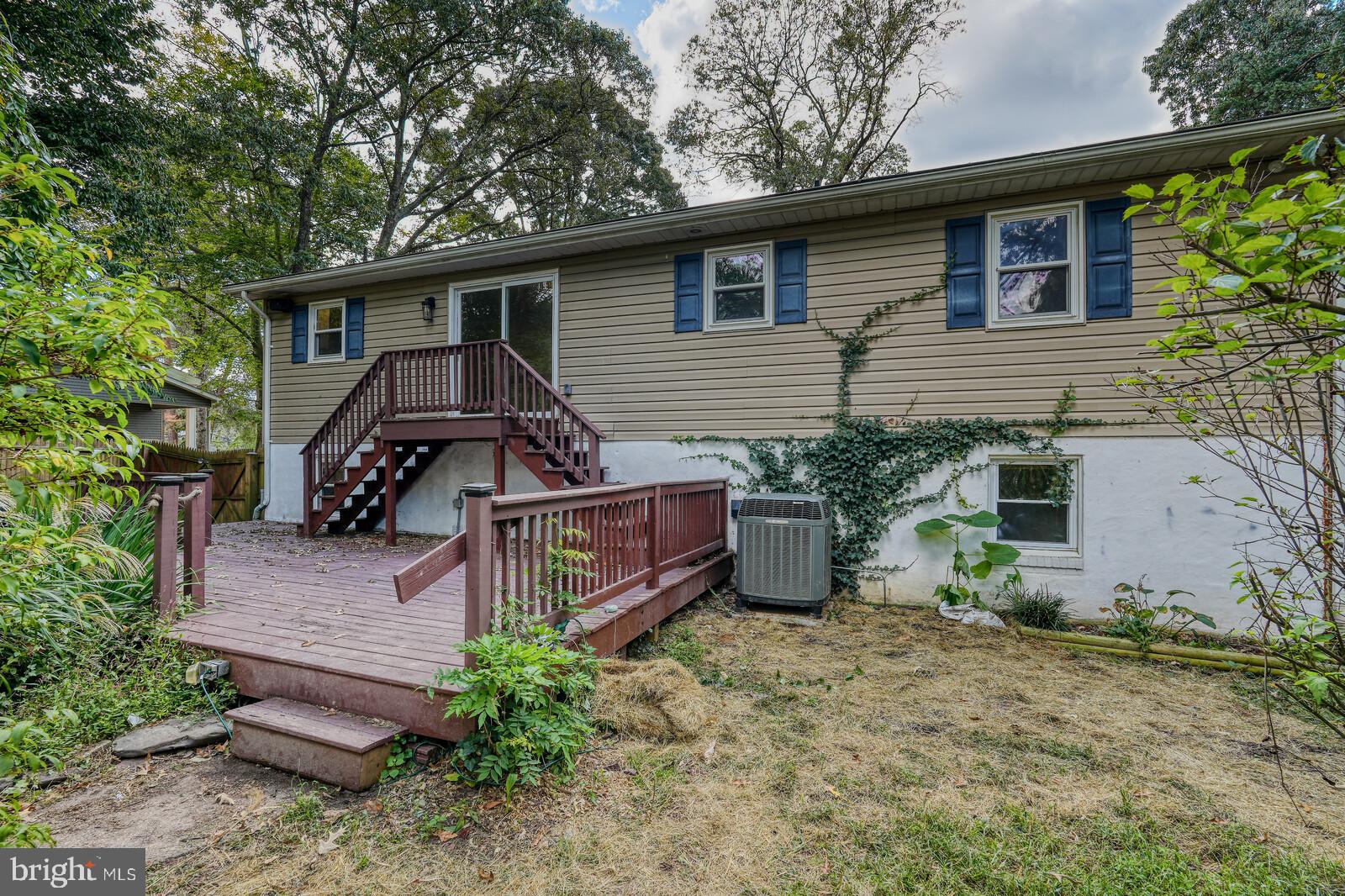 1142 Calvert Beach Road St. Leonard, MD 20685 - Photo 22 of 63 a view of a house with a yard and plants