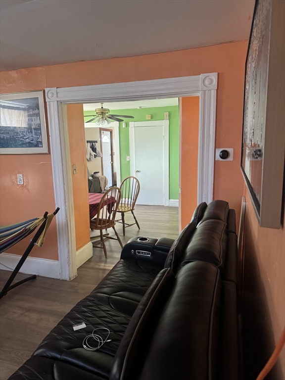 6 Minot Street, Unit 6 Lynn, MA 01905 - Photo 7 of 10 a living room with furniture and a window
