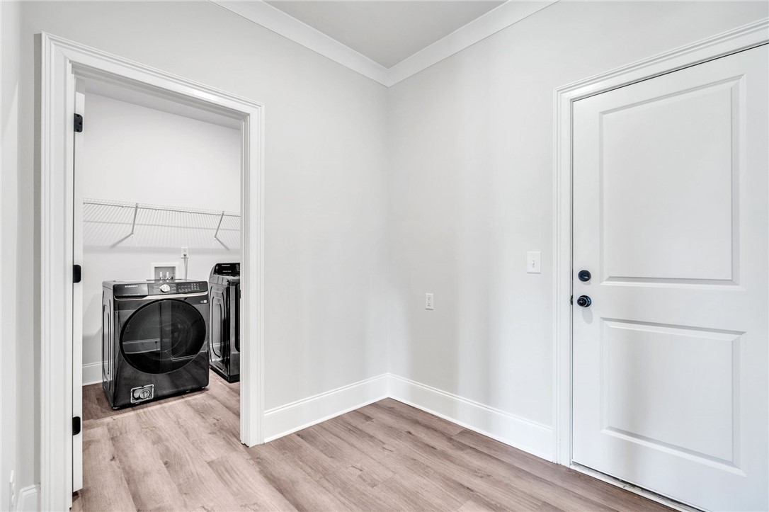 226 Holly Br Road Piedmont, SC 29673 - Photo 18 of 44 A dedicated laundry space provides ultimate convenience with modern appliances and practical shelving.