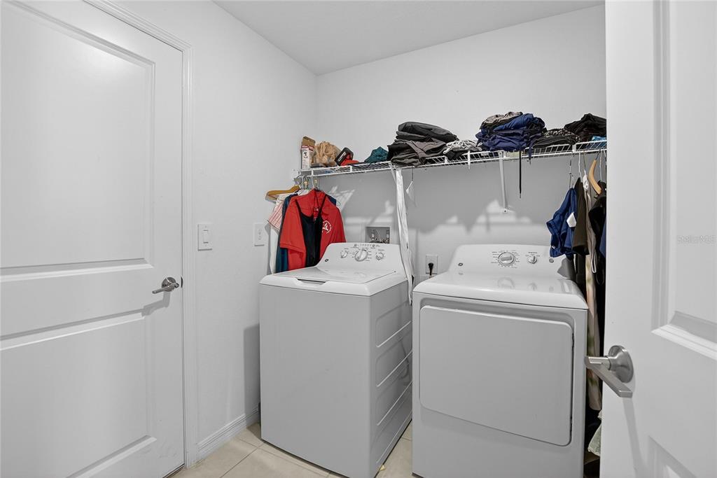 13084 Garnet Raspberry Avenue Wimauma, FL 33598 - Photo 17 of 20 a utility room with dryer and washer