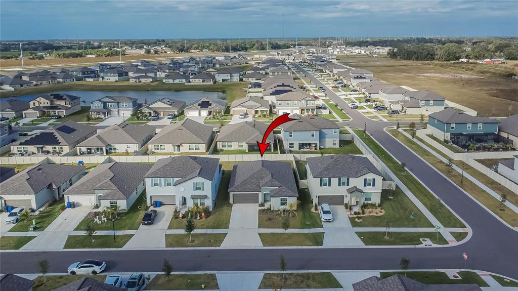 13084 Garnet Raspberry Avenue Wimauma, FL 33598 - Photo 18 of 20 an aerial view of residential houses with outdoor space