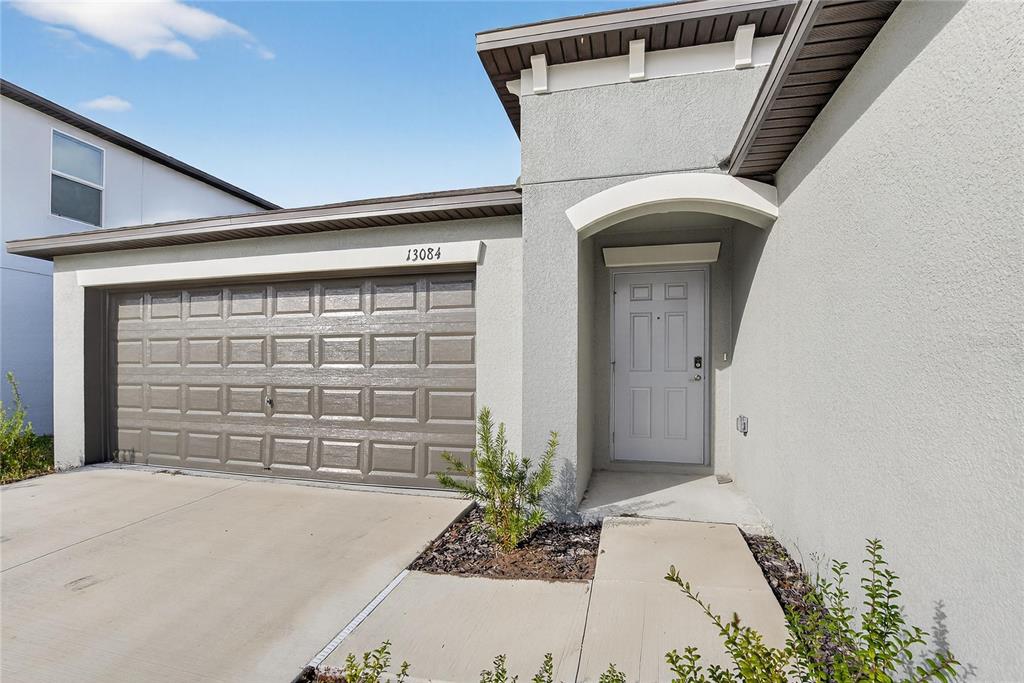 13084 Garnet Raspberry Avenue Wimauma, FL 33598 - Photo 2 of 20 front view of a house with a window