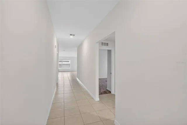 a kitchen with stainless steel appliances a stove a sink a microwave a refrigerator and cabinets