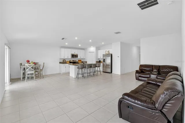 a bedroom with a bed and a dresser in it