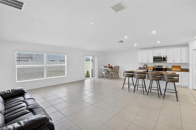 a bedroom with a bed and a chair