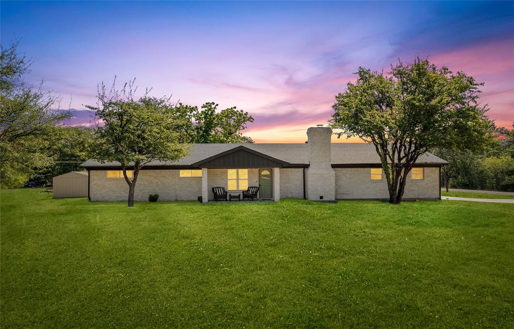 1933 Walter Smith Road Azle, TX 76020 - Photo 1 of 40 a big house with a big yard and large trees