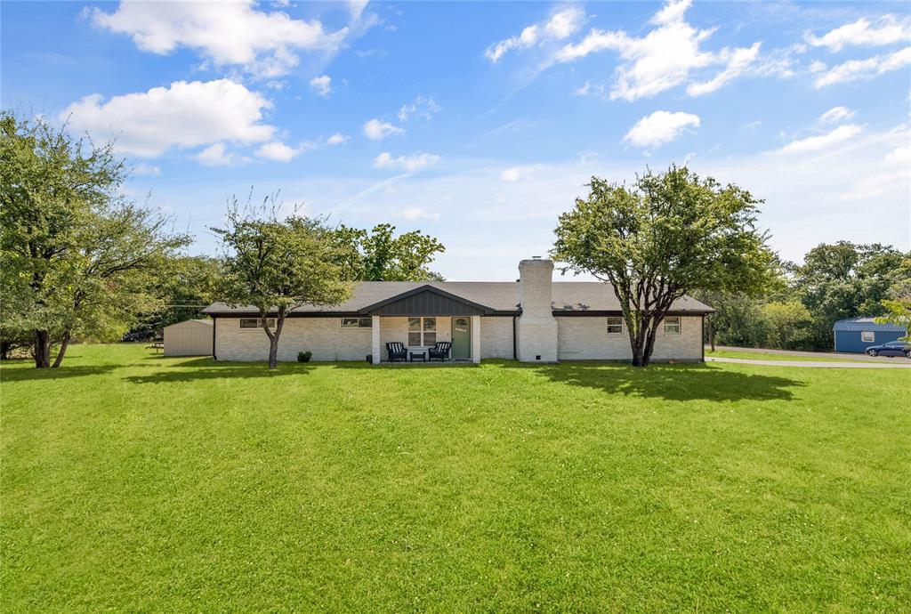 1933 Walter Smith Road Azle, TX 76020 - Photo 2 of 40 a view of a big yard with a house