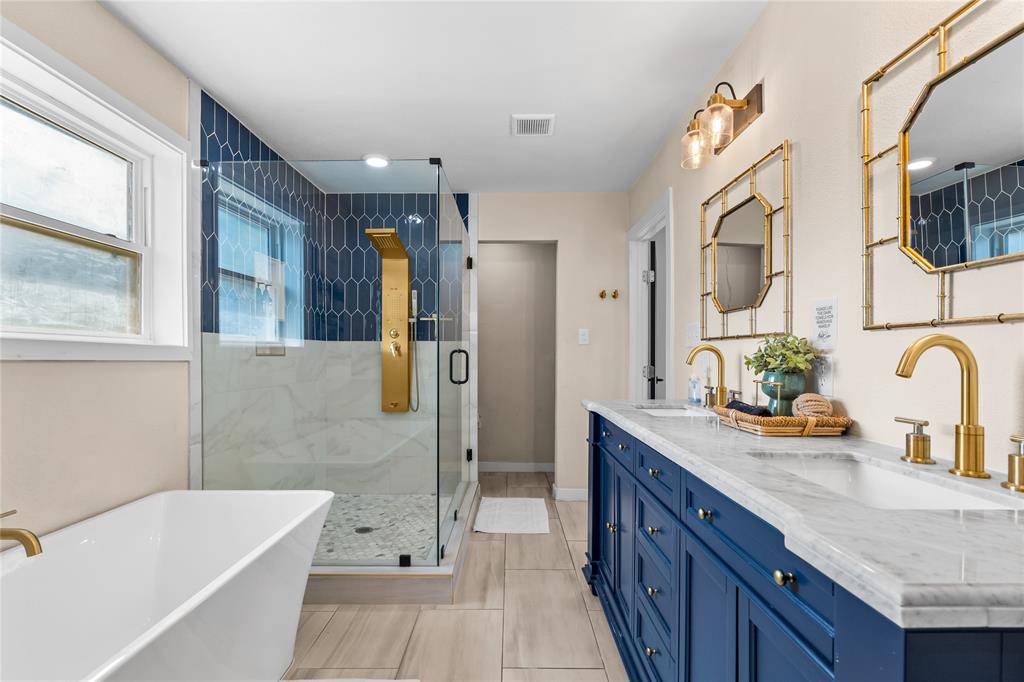 1933 Walter Smith Road Azle, TX 76020 - Photo 24 of 40 a bathroom with a tub sink and mirror