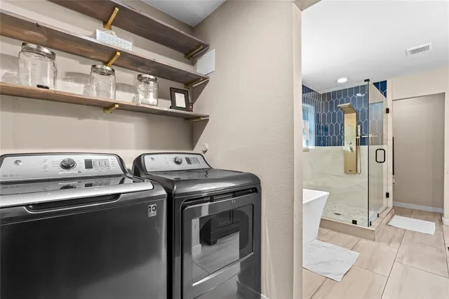 a utility room with dryer and washer