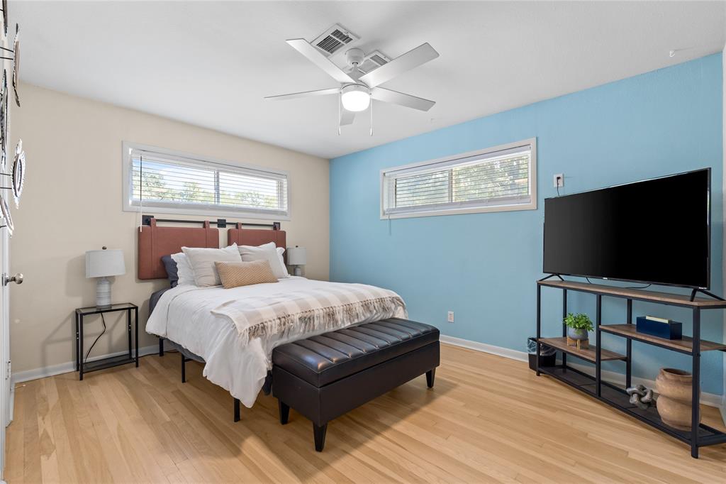 1933 Walter Smith Road Azle, TX 76020 - Photo 28 of 40 a bedroom with bed table and flat screen tv