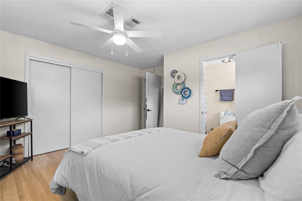 1933 Walter Smith Road Azle, TX 76020 - Photo 29 of 40 a bedroom with a bed and a flat screen tv