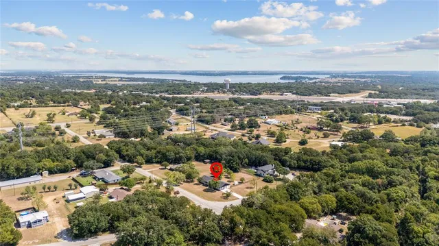 an aerial view of house with a yard