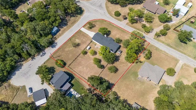 an aerial view of a multi story residential apartment building in the back yard