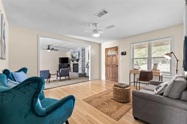 a living room with furniture or couch and a large window