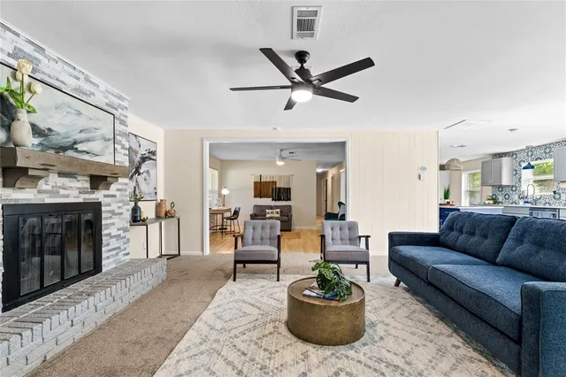 a living room with furniture or couch and a fireplace